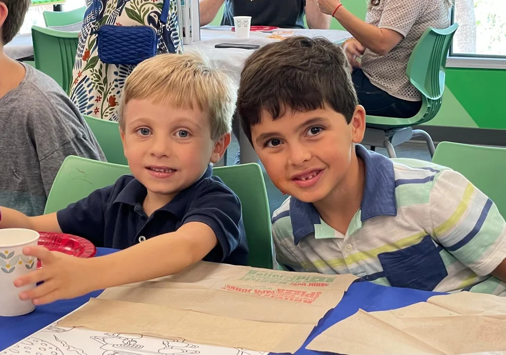 Two childhood friends smiling together
