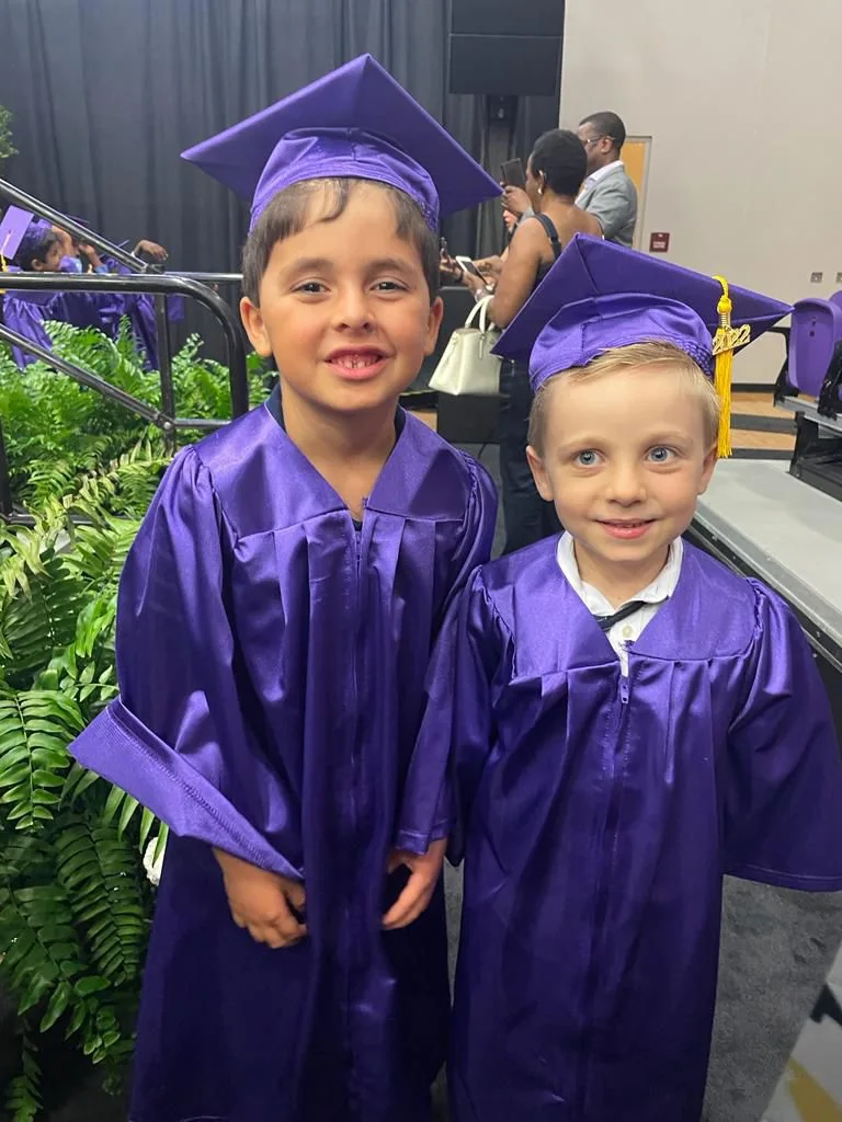 Two friends celebrating a graduation